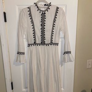 MIDI length white pom pom dress